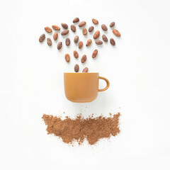 Closeup flatlay view of a yellow cup with cacao beans falling into it and cacao powder under, on white background. Drinking hot chocolate concept. Square composition