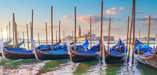 Venice cityscape and canal with gondolas - 728270913