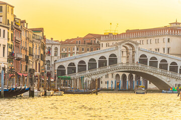 Panoramic view of famous Canal Grande with famous Rialto Bridge at sunset, Venice - 728270950