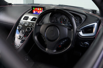 Obraz na płótnie Canvas Luxury sports car steering wheel leather interior