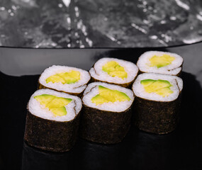 sushi maki rolls with avocado inside