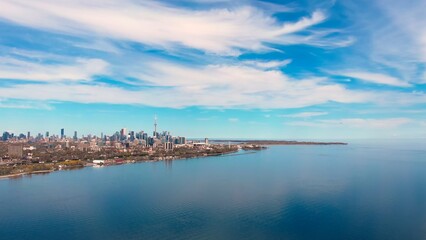 Naklejka premium Calm day Canadian lake, Toronto shores, plane takes off. Tourism, tranquil lake. Serene lake, backdrop. Tourism nature blend beautifully. Tourism experience, dynamic. Lake's appeal. Drone view.