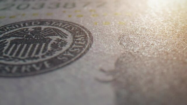 Explore a 100 dollars bill up close with stunning macro visuals. Discover hidden details on this American banknote. Green bonds and Impact investing concept. US dollar bills Background. 4K. 
