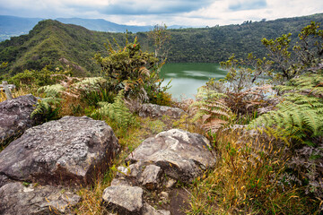Fototapeta na wymiar Lake Guatavita (Laguna Guatavita) located in the Cordillera Oriental of the Colombian Andes. Sacred site of the native Muisca Indians. Cundinamarca department, Colombia wilderness landscape.