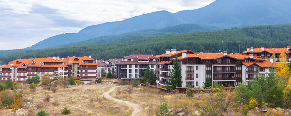 Bansko, Bulgaria houses and hotels, autumn banner