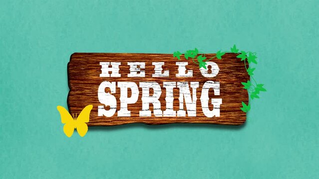 A wooden sign that says Hello Spring with a butterfly on the side, set against a light blue background. A cheerful welcome to the new season