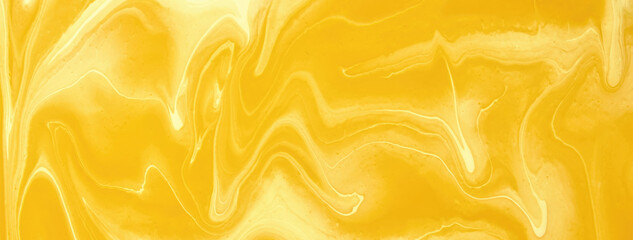 Abstract fluid art background yellow and golden colors. Liquid marble. Acrylic painting on canvas with amber gradient