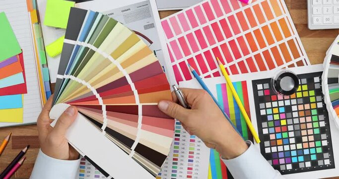 Graphic designer at work creativity and color palette top view