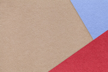 Texture of beige craft color paper background with blue and red border. Vintage abstract brown cardboard.