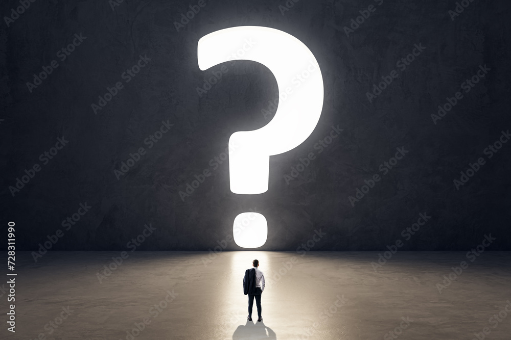 Poster back view of tiny businessman in concrete room interior with huge bright question mark opening. doub