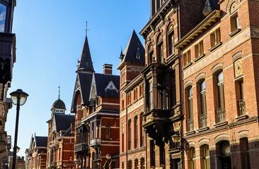 Gordijnen Old buildings in Antwerp, Belgium. Historic center of city. Travel photo © OLAYOLA