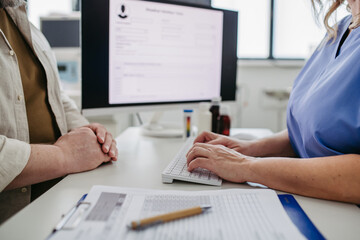 Doctor consulting with overweight patient, discussing test result in doctor office. Concept of...