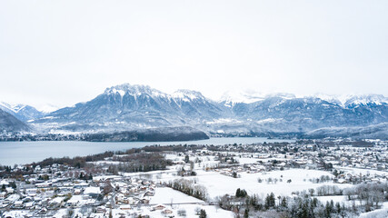 Fototapeta na wymiar Lake Annecy, Tournette, mountains and snow, sunset photo in Haute-Savoie in winter