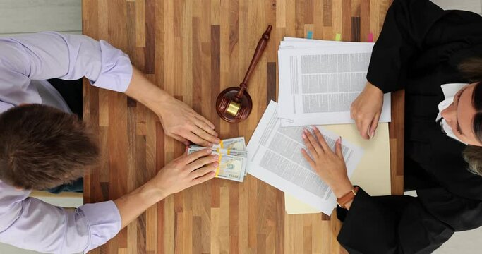 Woman judge refuses to take bribe from businessman top view