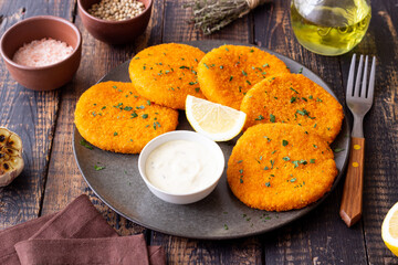 Fish cakes with white sauce and lemon. Seafood. Healthy eating.