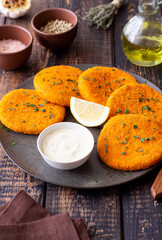 Fish cakes with white sauce and lemon. Seafood. Healthy eating.