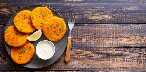 Fish cakes with white sauce and lemon. Seafood. Healthy eating.