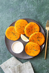 Fish cakes with white sauce and lemon. Seafood. Healthy eating.