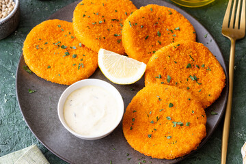 Fish cakes with white sauce and lemon. Seafood. Healthy eating.