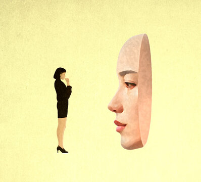 Thoughtful woman standing in front of oversized female mask