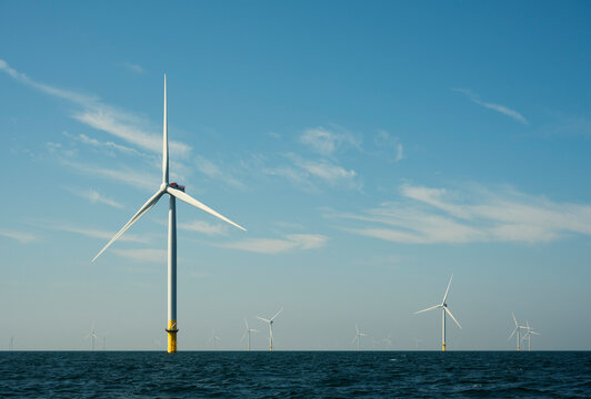Netherlands, Zeeland, Domburg, Sky over offshore wind farm in North Sea