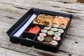 Set of the different sushi on wooden table
