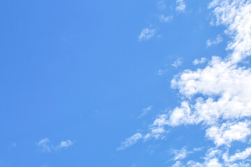 Blue sky with white fluffy cloud. Cumulus clouds background. Cloudscape morning sky. The concepts of freedom of life, never give up and positive though energy.