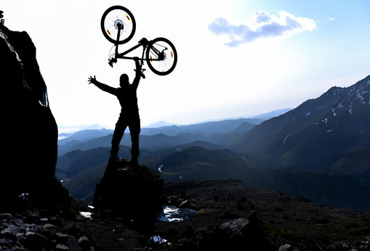 Riding a mountain bike to the top of the mountains and the happiness of success