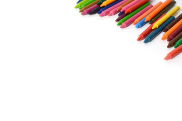 Crayons lined up isolated on white background.
