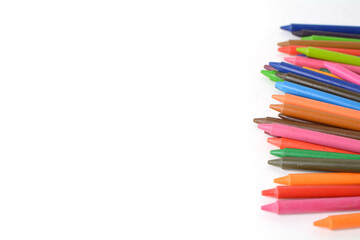 Fototapeta premium Crayons lined up isolated on white background.