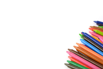 Crayons lined up isolated on white background.