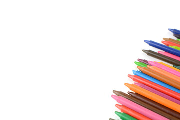 Crayons lined up isolated on white background.