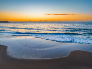 Sunrise at the seaside with orange horizon
