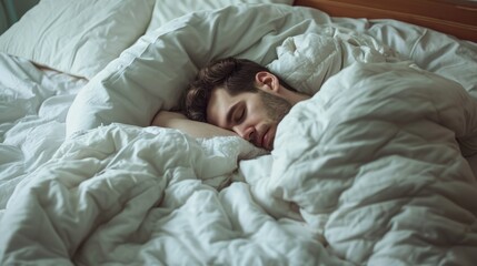 Relaxed Portrait of a Young Man Sleeping in a Cozy Bed at Home