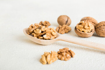 Fresh healthy walnuts in bowl on colored table background. Top view Healthy eating bertholletia concept. Super foods