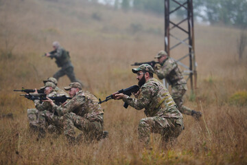 A disciplined and specialized military unit, donned in camouflage, strategically patrolling and...
