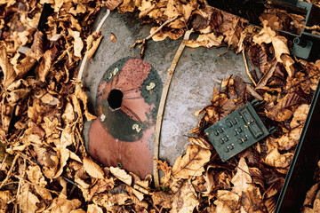 Broken Cathode Electron Beam Tube of Old TV, shattered television trash in the woods, littering in...