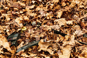Broken Cathode Electron Beam Tube of Old TV, shattered television trash in the woods, littering in...