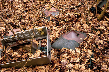 Broken Cathode Electron Beam Tube of Old TV, shattered television trash in the woods, littering in...