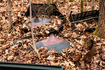 Broken Cathode Electron Beam Tube of Old TV, shattered television trash in the woods, littering in the forest, illegal landfill, forest pollution