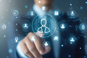 Fototapeta premium A man in a business suit is touching a button with icons. This image can be used to represent technology, innovation, or decision-making