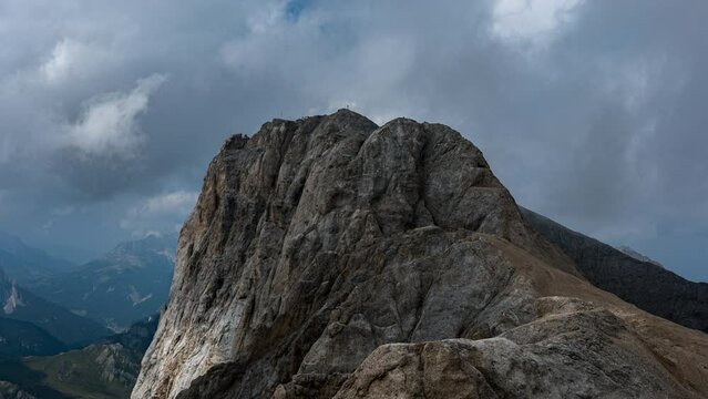 Dolomites Marmolada rocky summit time lapse cloud shadows speeding above rugged peaks