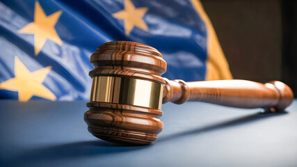 Close up of wooden gavel on the table with european union flag in the background. Legal system and justice concept - obrazy, fototapety, plakaty
