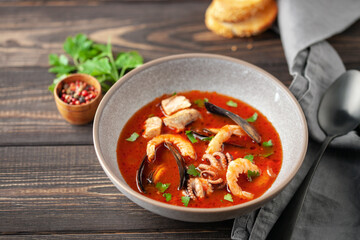 French seafood bouillabaisse soup with mussels, prawns, octopus and fish.
