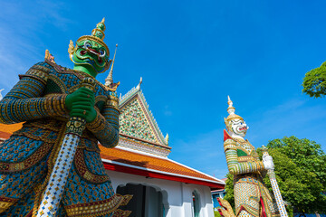 Statues of Giants in gate of temple demon guardians at Wat Arun