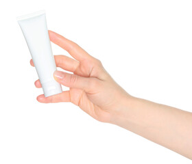 Woman hand holds a white cosmetic cream tube, on white background close-up, template for cosmetics ads