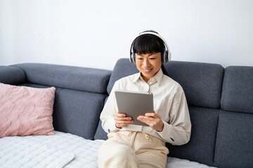 Japanese woman having online english classes at home.