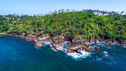 Fototapeta na wymiar Beautiful Indian Ocean coastline on the island of Sri Lanka, Mirissa. Aerial photography.