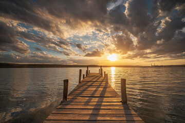 Small Dock at the lake water at sunset landscape, seascape sunrise - 728413382