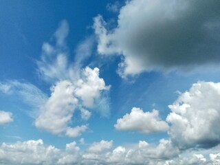 Naklejka na ściany i meble Cloudy blue sky in the countryside.